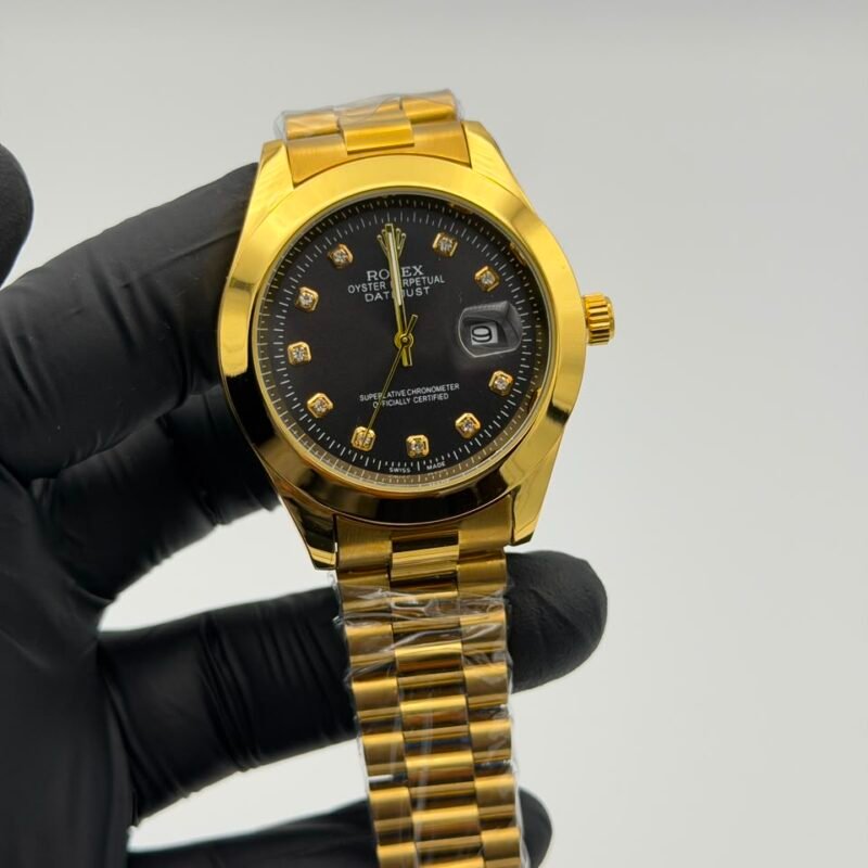 Black-dial-full-gold-watch-with-crystal-style-hour-markers-and-date-display.jpeg Black Dial Full Gold Watch – Crystal Markers