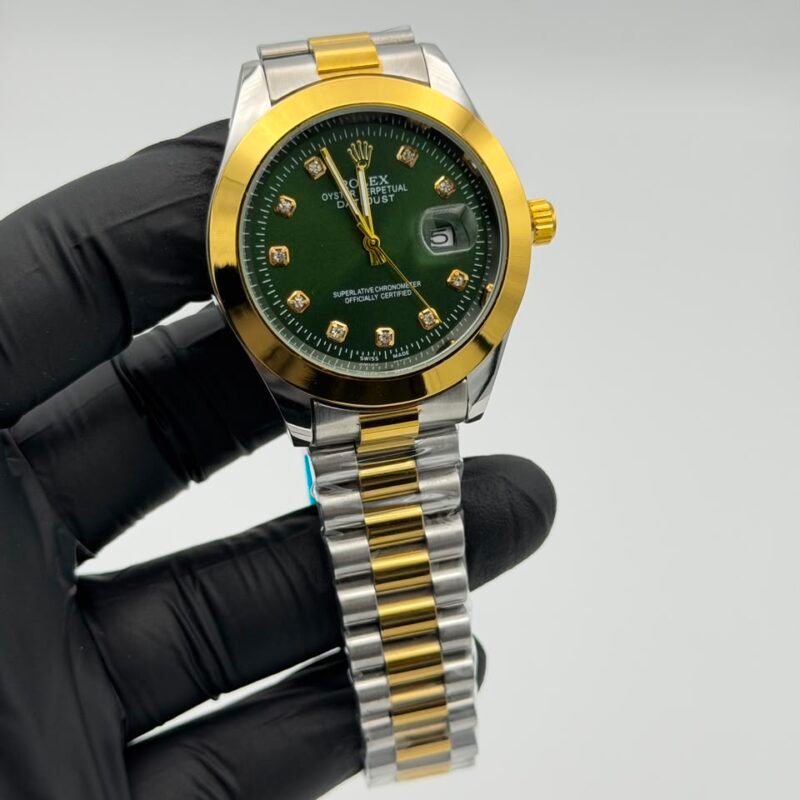 Green-dial-two-tone-gold-and-silver-watch-with-crystal-hour-markers-and-date-display.jpeg Green Dial Two-Tone Gold & Silver Watch – Crystal Markers